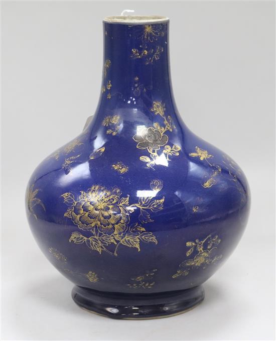 A Chinese Kangxi style dark powder blue ground vase, with gilt decoration of flowers and fruit,